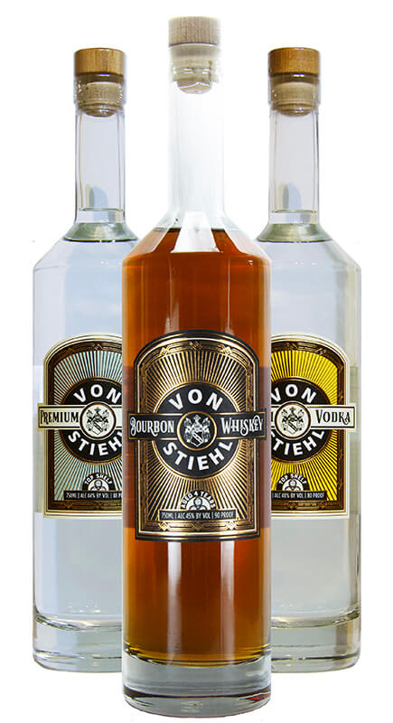 Three bottles of Von Stiehl craft spirits featuring Bourbon Whiskey, Premium Gin, and Vodka.