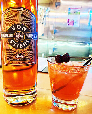 A signature cocktail featuring small-batch craft bourbon distilled at von Stiehl in Algoma.